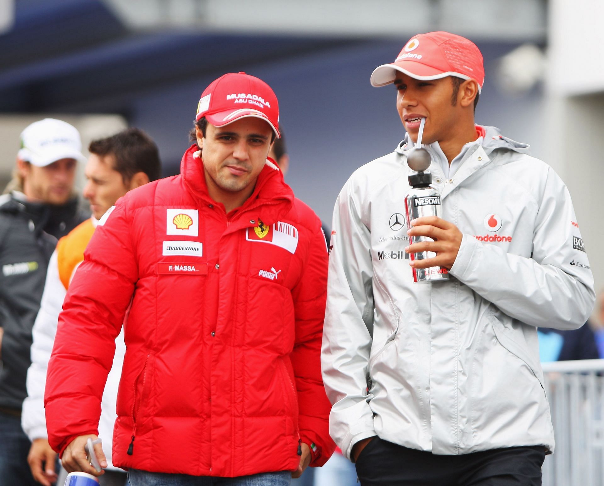Felipe Massa (L) of Brazil and Ferrari and Lewis Hamilton (R) of Great Britain and McLaren Mercedes are seen in the paddock at the F1 Grand Prix of Germany - Source: Getty